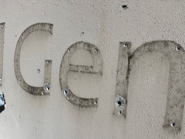 Close-up of dimensional letter shadows on precast concrete