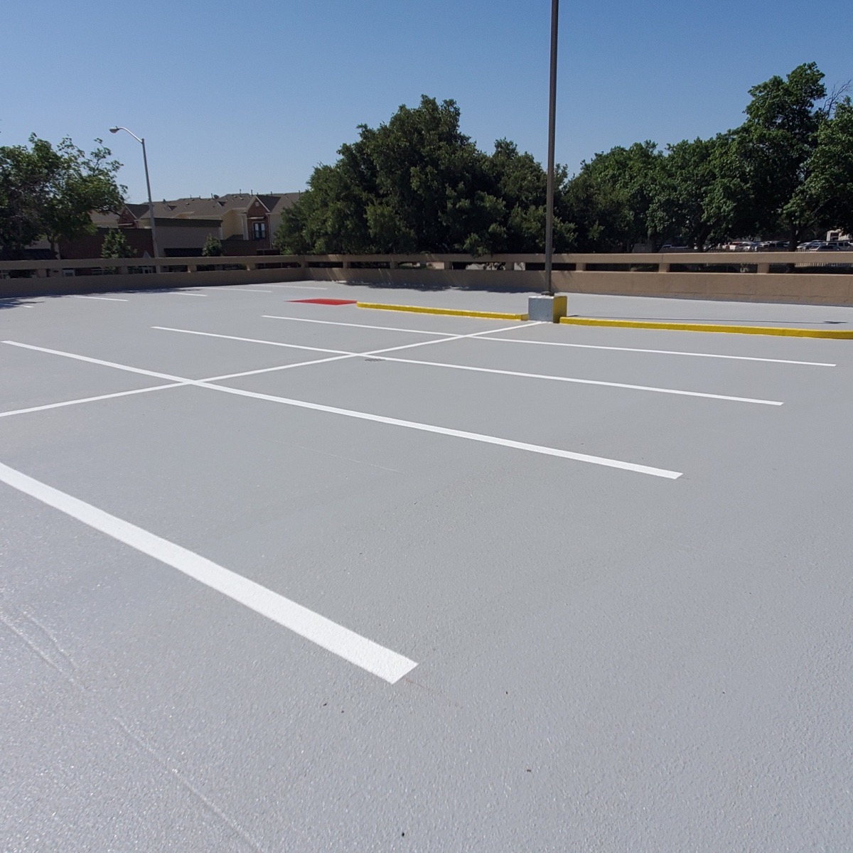 Freshly coated and striped parking garage deck
